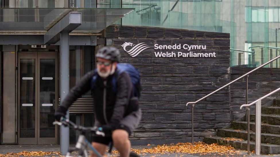 Cyclist in front of the Senedd