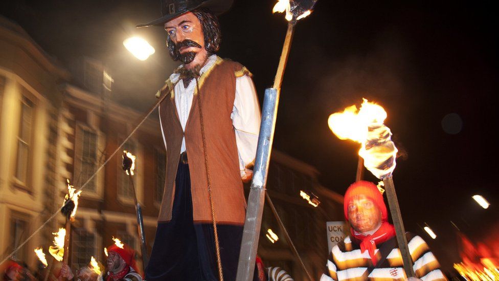 a guy being burned at bonfire night parade