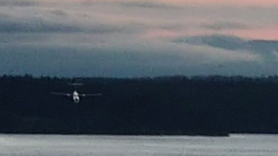 A still taken from a video showing the plane above the water
