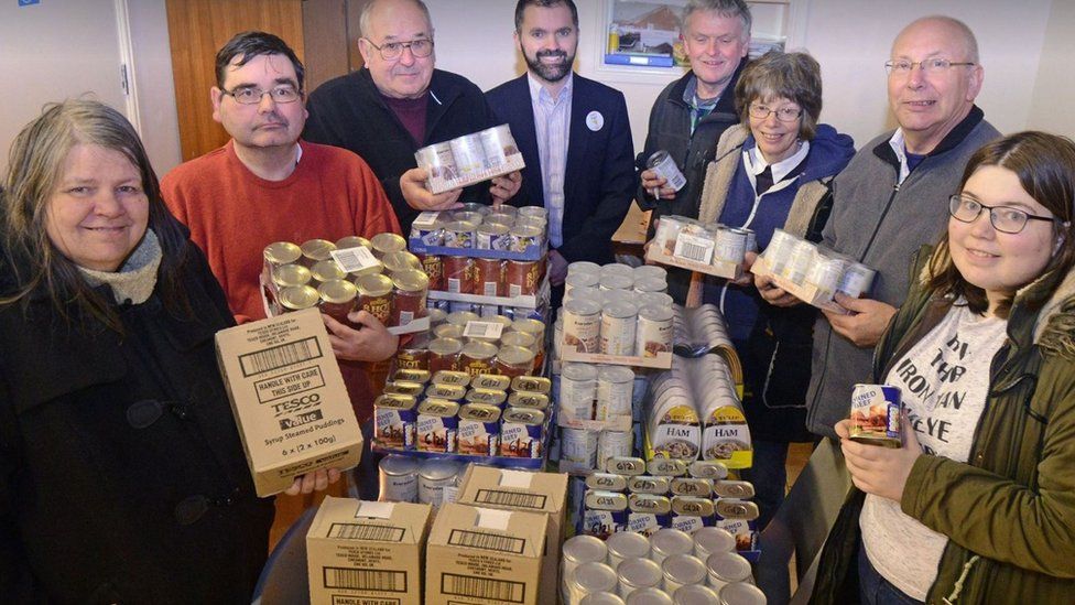 Volunteers with food donations