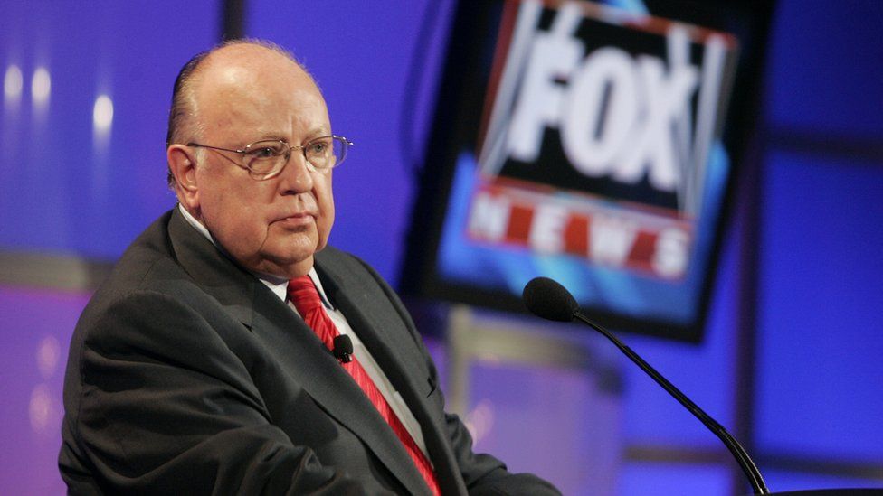 Roger Ailes with a Fox News sign