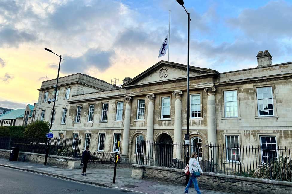 The flag at Emmanuel College in Cambridge is flying at half-mast