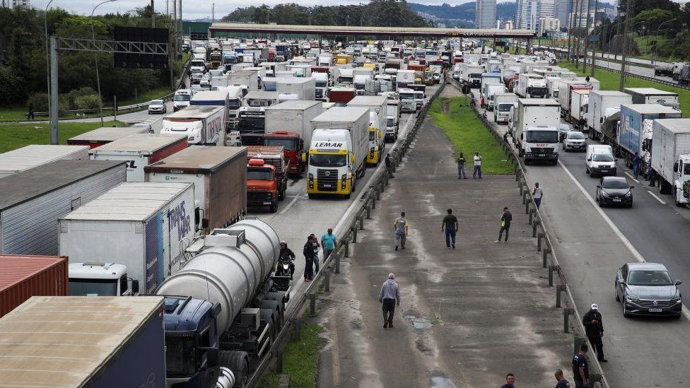 Supporters of Brazil's President Jair Bolsonaro, mainly truck drivers, block the Castello Branco highway during a protest over Bolsonaro's defeat in the presidential run-off election, in Barueri, Brazil November 1, 2022.