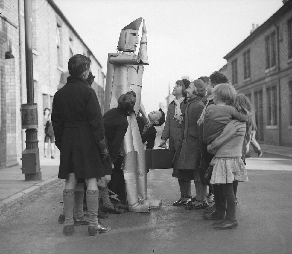 The children of Kettering in Northamptonshire stare in amazement at a robot