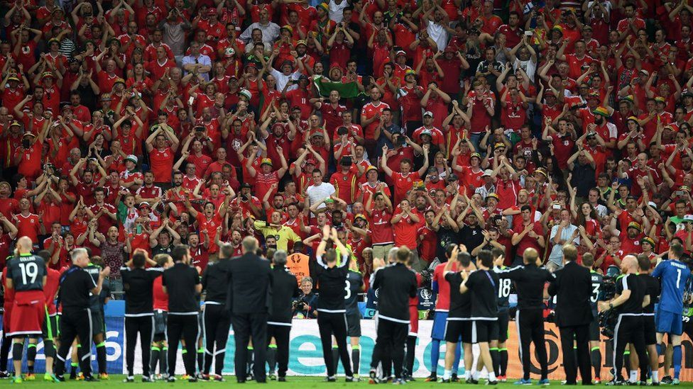 Wales fans applaud the team after their defeat to Portugal