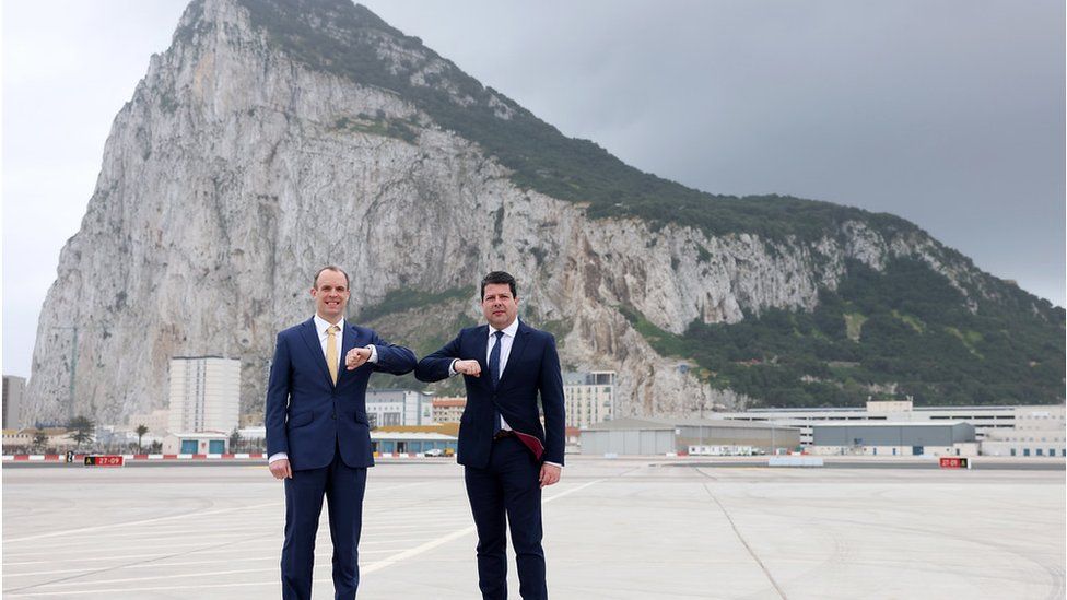 Foreign Secretary Dominic Raab is greeted by Chief Minister Fabian Picardo as he arrives at RAF Gibraltar