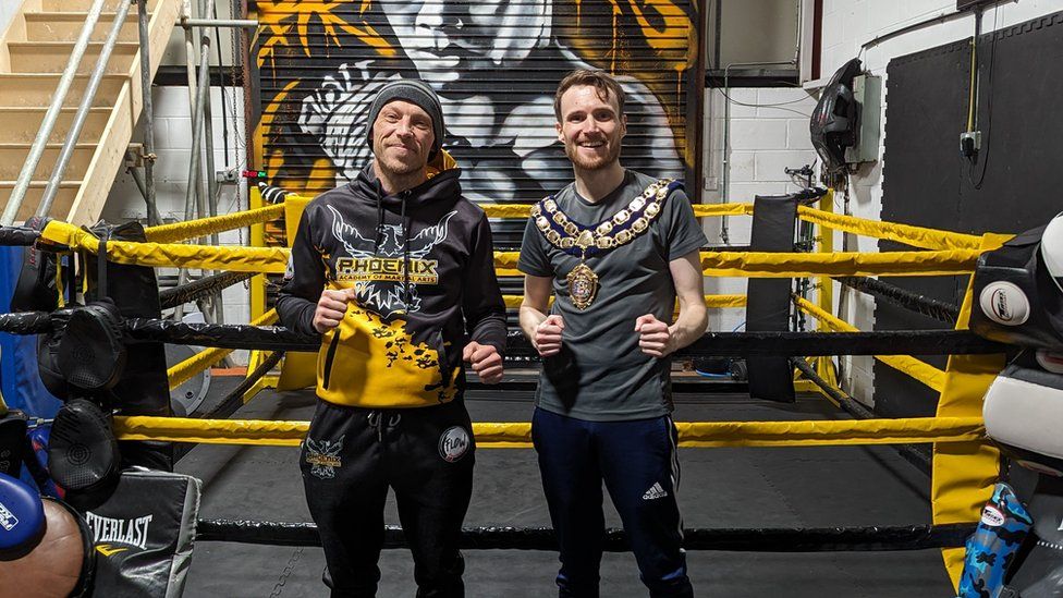 Ciaran Cronnelly pictured with a coach at Phoenix Academy of Martial Arts