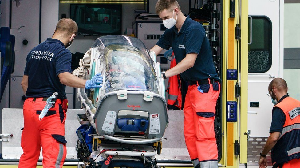 German army emergency personnel load portable isolation unit (Epi Shuttle) into their ambulance that was used to transport Russian opposition figure Alexei Navalny at Charite hospital on August 22, 2020 in Berlin, Germany
