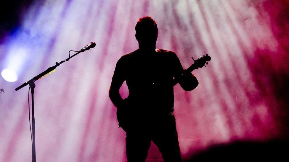 Guitarist in silhouette