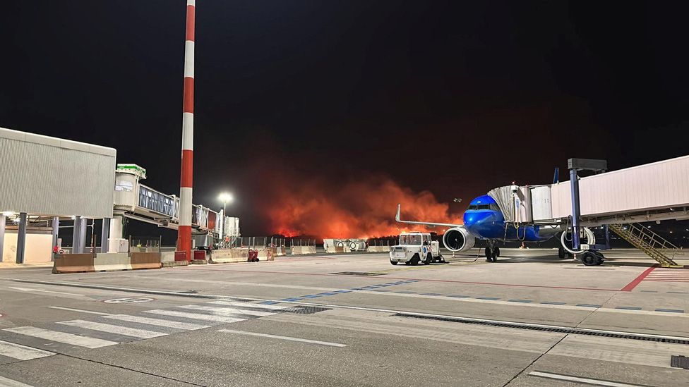 A wildfire burns near the Sicilian airport "Falcone-Borsellino" near Palermo