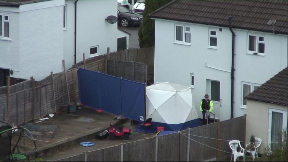 The back garden of the house in Sea Mills with a white forensic tent and blue screen