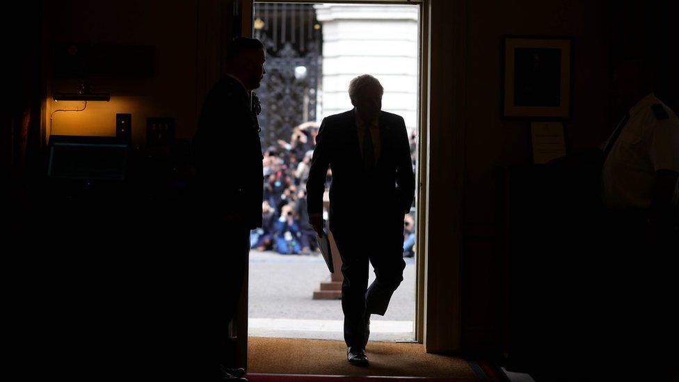 London, United Kingdom. Prime Minister Boris Johnson resignation. The Prime Minister Boris Johnson walks back through the No10 door after delivering his statement in Downing Street after resigning as the leader of the Conservative Party. Picture by Andrew Parsons / No 10 Downing Street
