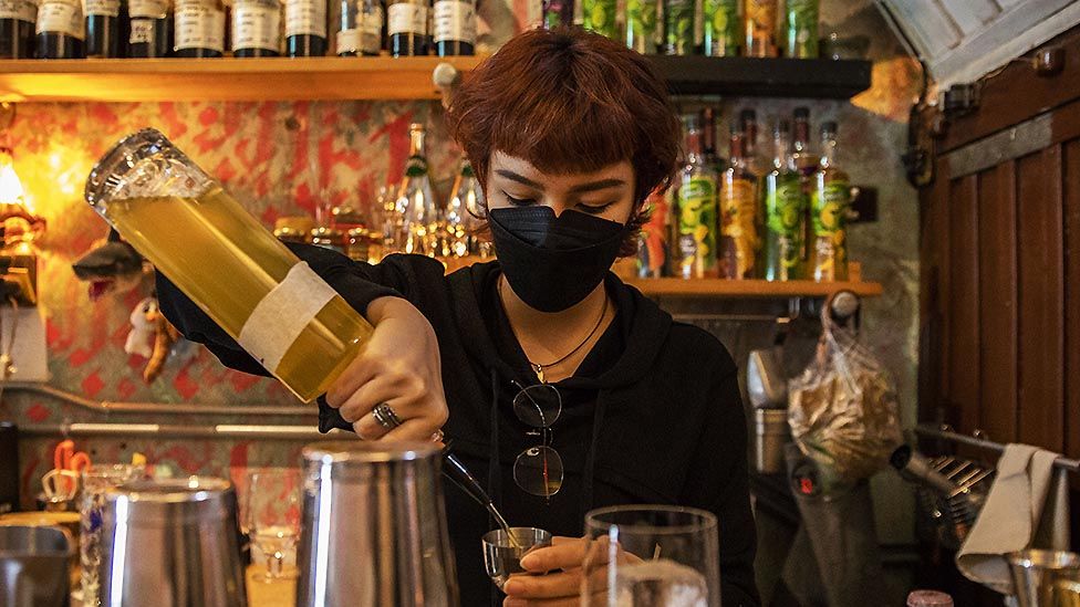 Woman preparing cocktails