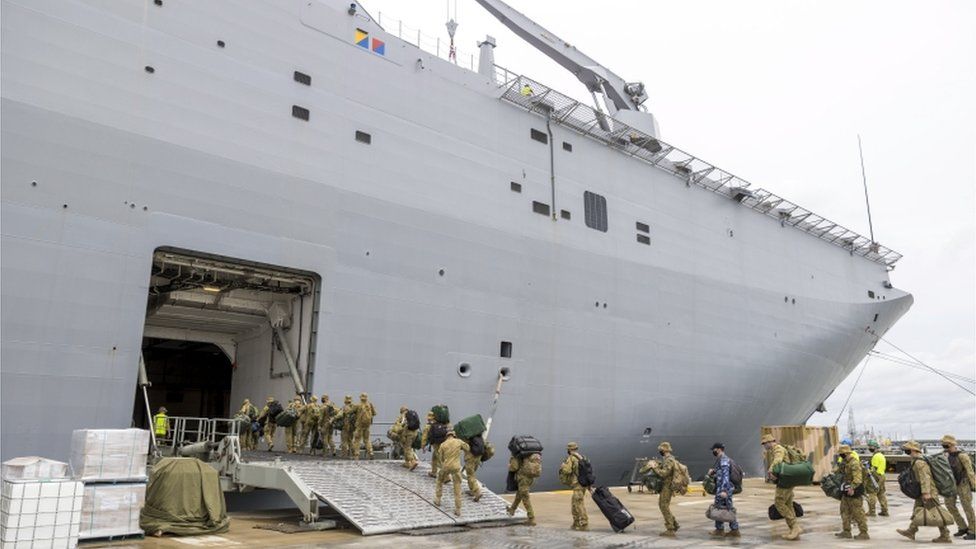 Australian Defence Force (ADF) personnel embarking onto HMAS Adelaide at the Port of Brisbane, Queensland, Australia, 20 January 2022 (issued 21 January 2022), before departure on Operation Tonga Assist 202 following the eruption of Tonga"s Hunga Tonga- Hunga Ha"apai underwater volcano on 15 January.
