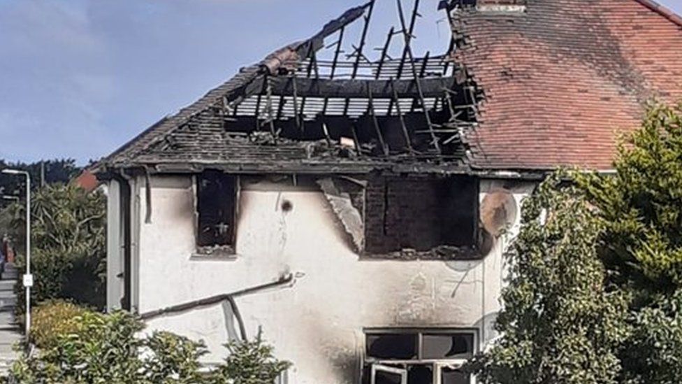 The fire-damaged house on Victoria Road.