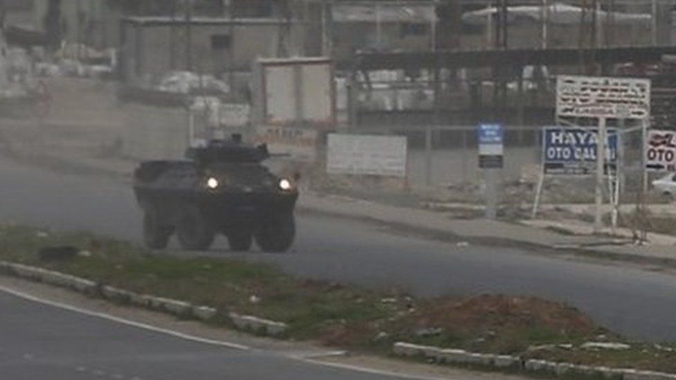 Armoured vehicles of Turkish forces patrol at the south-eastern town of Nusaybin, Turkey, near the border with Syria (14 February 2016)