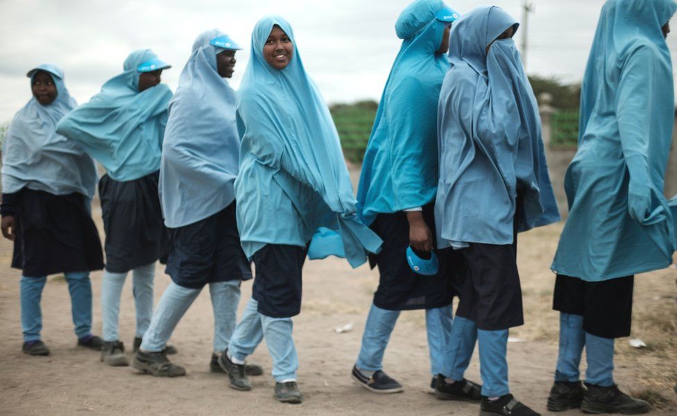 Schoolgirls in blue headscarves line up for lunch in Kajiado, Kenya - Wednesday 11 July 2018