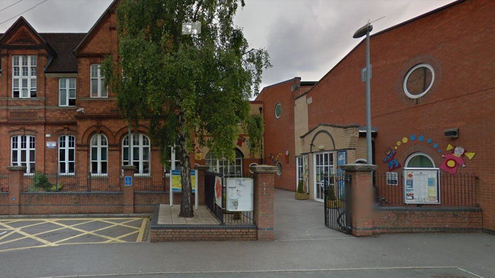 Red brick Victorian-era primary school with a modern red brick building attached to it.