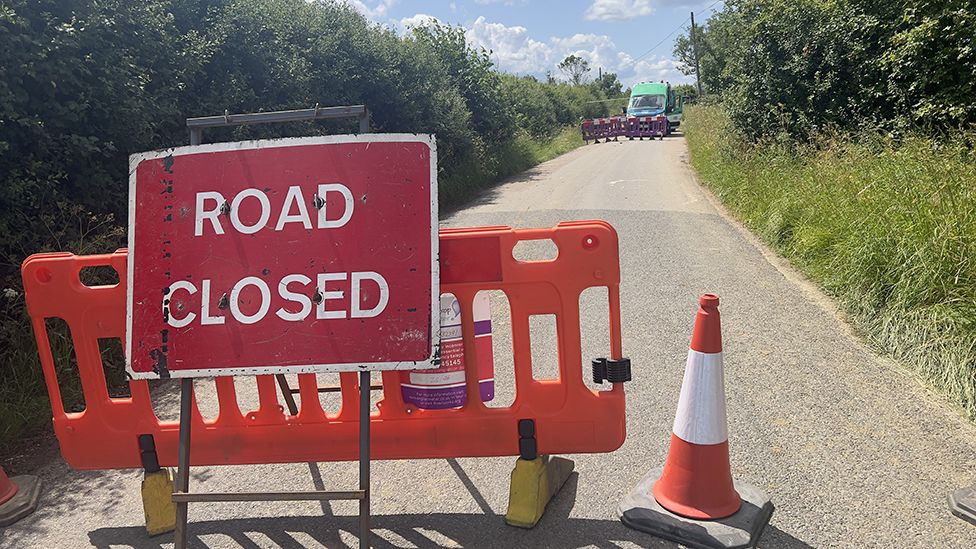 The road closed sign near the burst water main in Stansfield, Suffolk