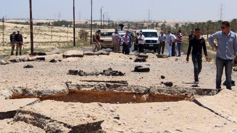 Egyptian security officials inspect the site of a bomb blast between al-Arish and Rafah, Sinai. Photo: July 2015