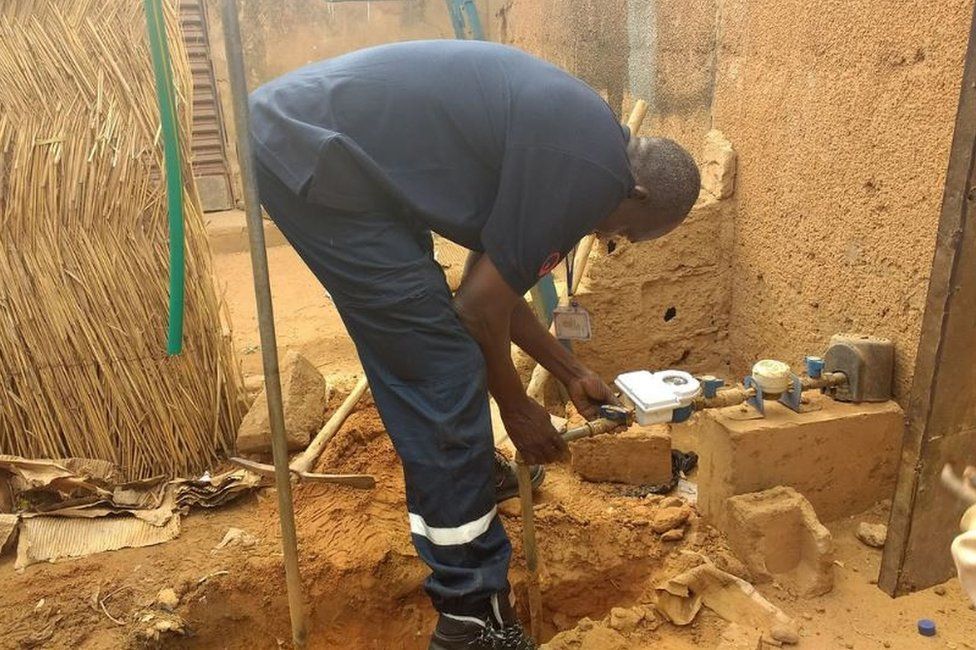 Engineer installing water meter