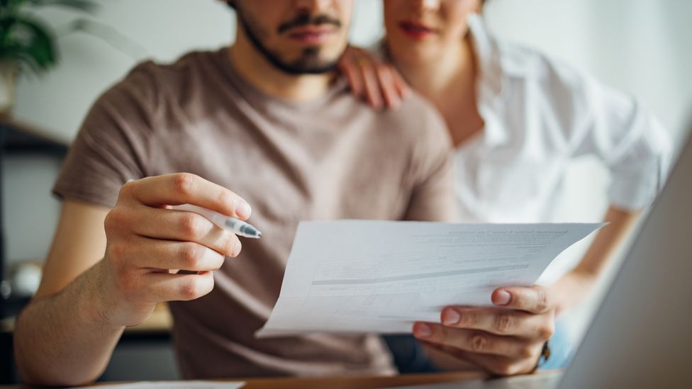 Couple looking at a bill