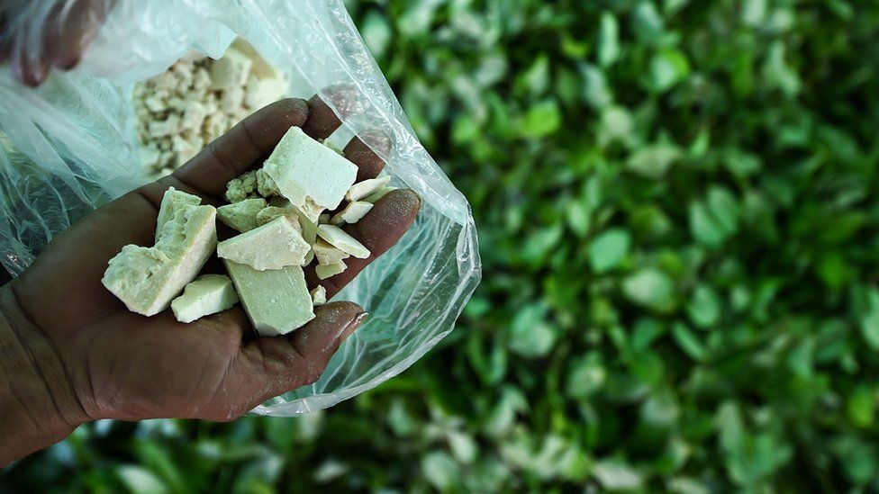 A farmer holds cocaine paste processed in Colombia, 25 September 2017