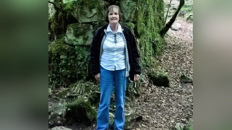 Patricia Finnie standing in a wooded area