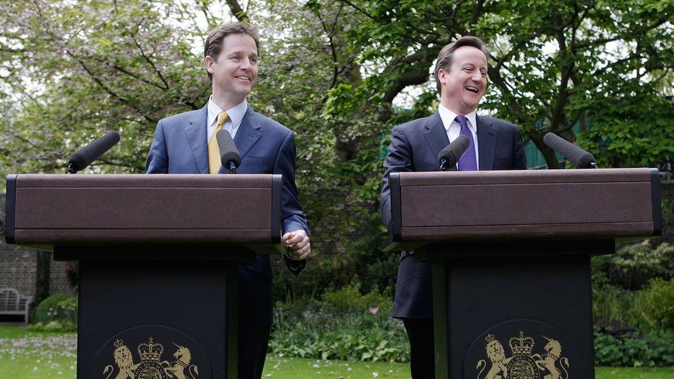 Prime Minister David Cameron (R) and Deputy Prime Minister Nick Clegg share a joke as they hold their first joint press conference in the Downing Street garden on May 12, 2010 in London, England