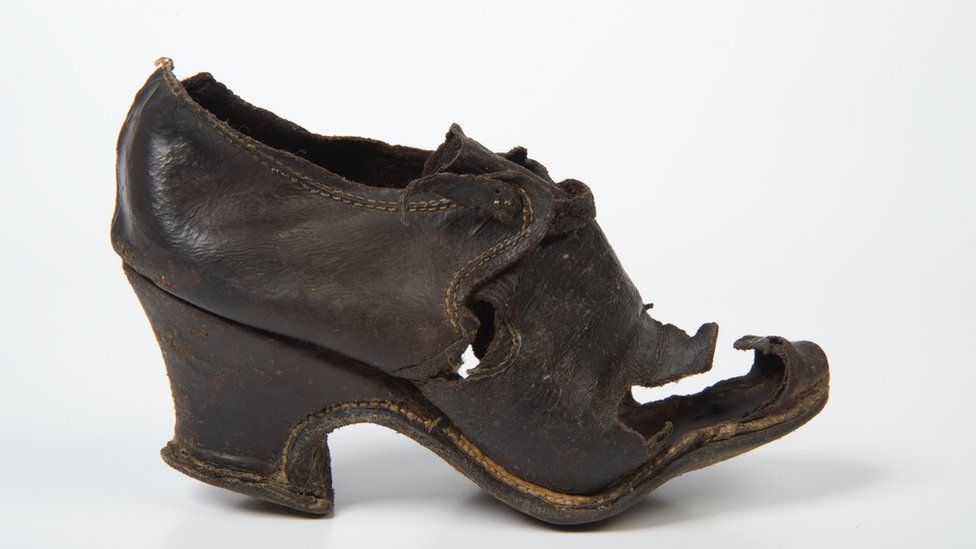 Woman's latchet tie shoe, 1675-99. Found bricked up in a wall after investigating death watch beetle in Ely Cathedral