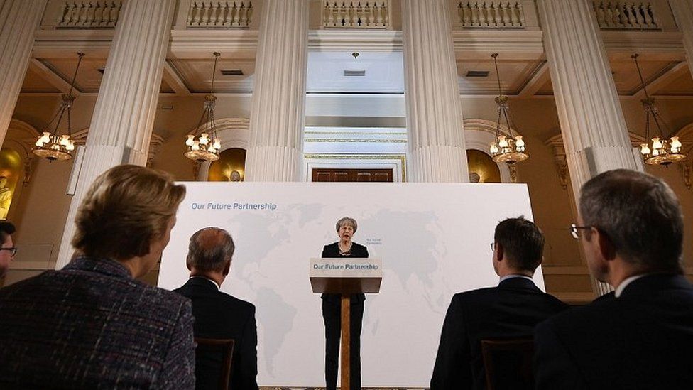 Theresa May speaking in London