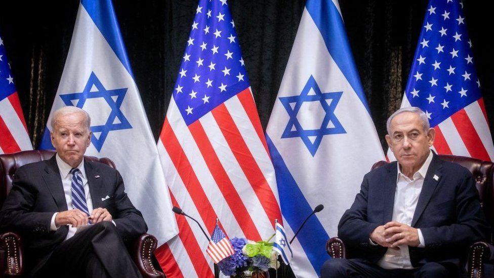 A photo of US president Joe Biden seated next to Israeli prime minister Benjamin Netanyahu