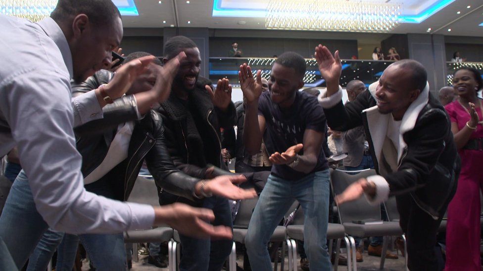 Five members of the congregation dancing