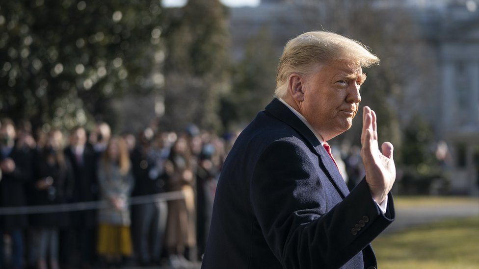Donald Trump waves as he walks to Marine One on the South Lawn of the White House on 12 January