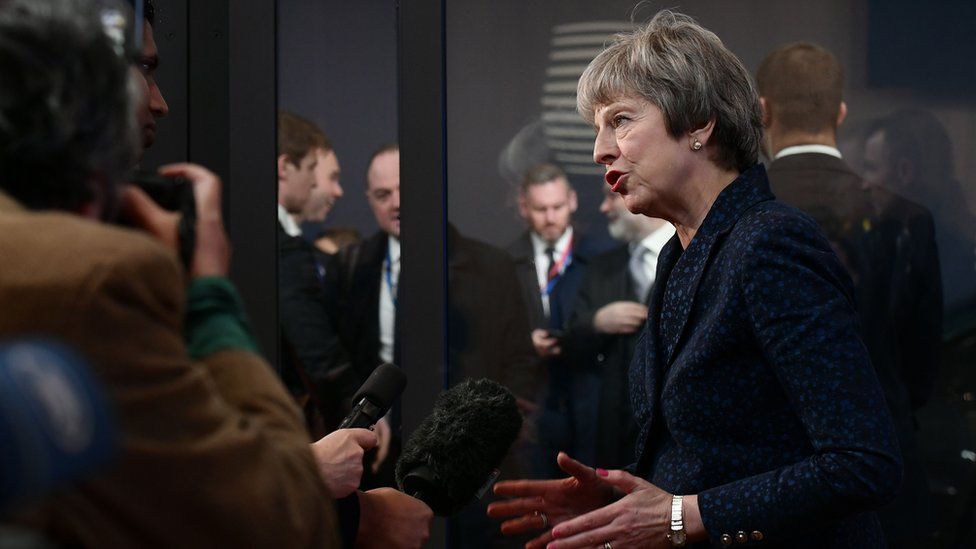Theresa May speaks to the media after Brexit talks at EU HQ in Brussels