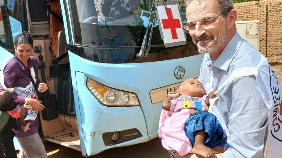 Aid worker with baby