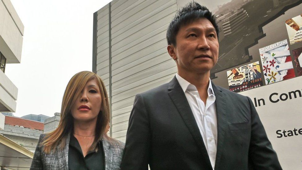 City Harvest Church founder Kong Hee (R) arrives with his pop-singer wife Ho Yeow Sun (L) at the district state courts in Singapore on October 21, 2015.