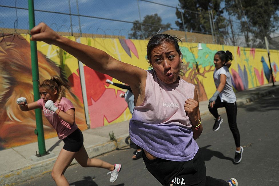 Women participate in a self-defence class