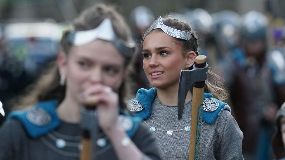 Girls taking part in Up Helly Aa