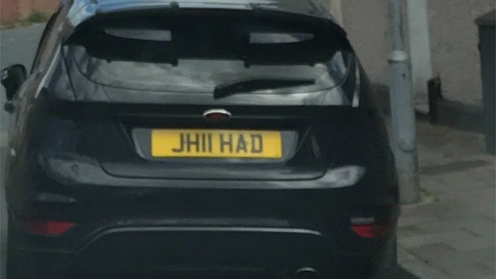 A black Ford Fiesta with the registration plate JH11 HAD