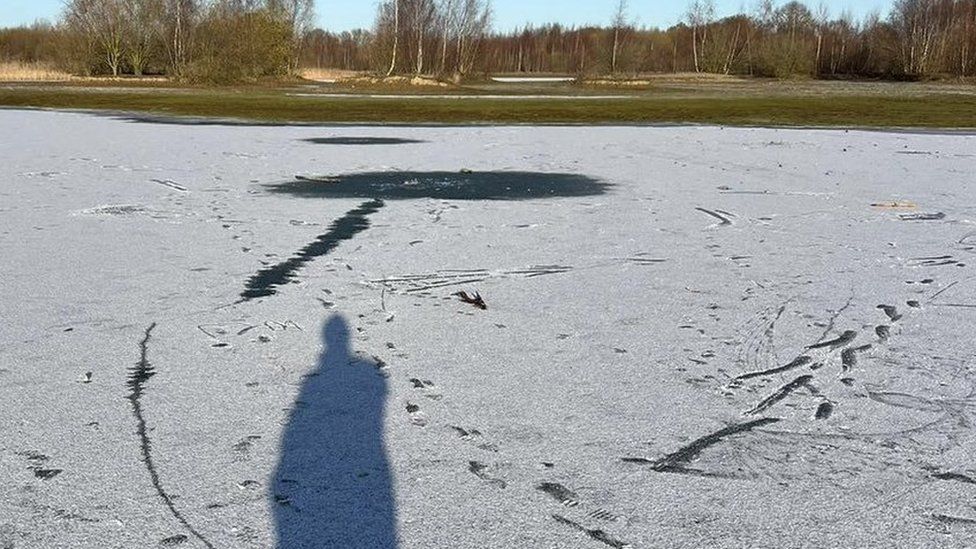 Footprints on frozen lake