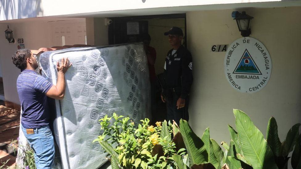 Workers bring mattresses to the Nicaraguan Embassy as many items arrived for former president Ricardo Martinelli in Panama City, Panama, 08 February 2024.