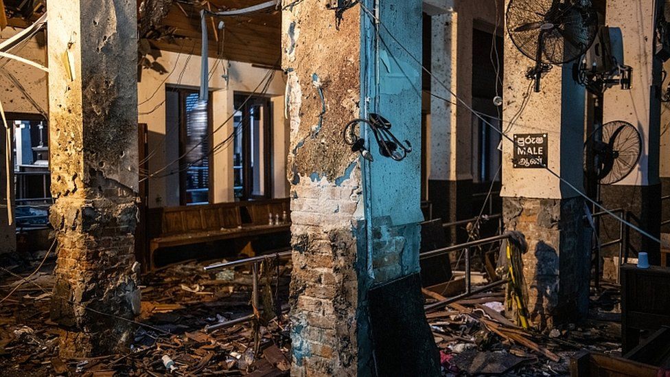 Debris pictured inside St Anthony's shrine from behind a police cordon on April 26, 2019 in Colombo, Sri Lanka