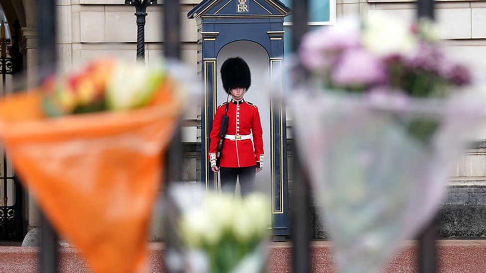 Flowers and tributes to Queen Elizabeth II are pictured outside of Buckingham Palace in London on 9 September 2022