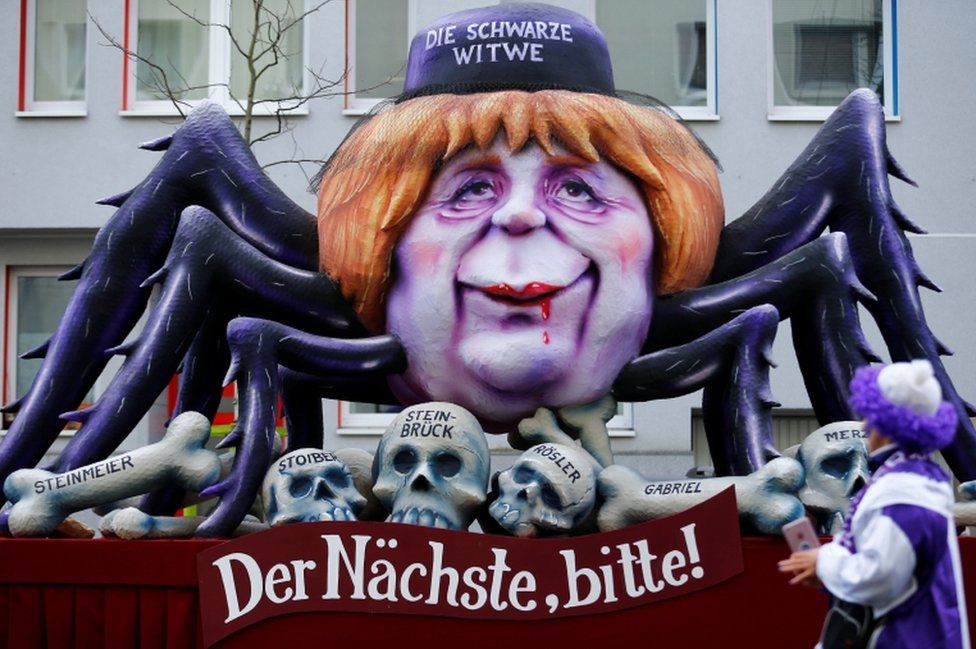 A carnival float shows Christian Democratic Union (CDU) leader and German Chancellor Angela Merkel as black widow at the traditional "Rosenmontag" Rose Monday carnival parade in Duesseldorf, Germany, February 12, 2018. Slogan reads "Next one please