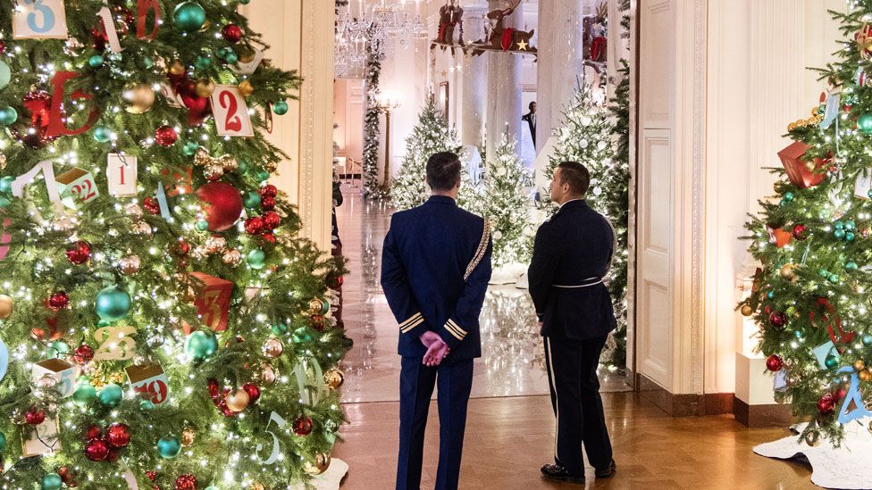 Servicemembers are seen in the East Room during the media preview of the 2023 Holidays at the White House decor on Monday, November 27, 2023
