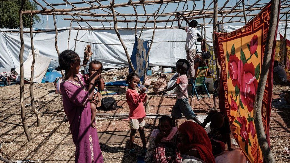 Newly arrived Ethiopian refugees who fled Ethiopia's Tigray conflict rest at Um Raquba refugee camp in Gedaref, eastern Sudan, on December 9, 2020