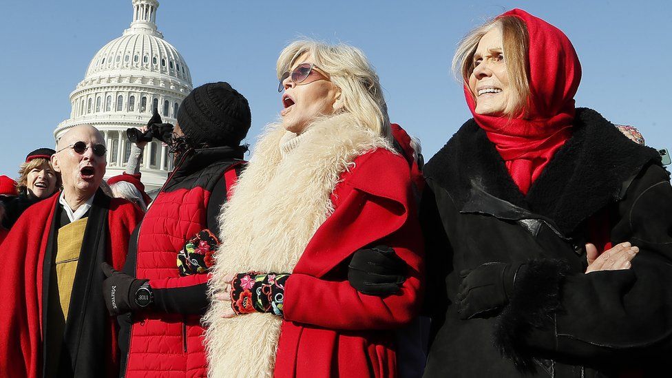 Actress and activist Jane Fonda (C) and Gloria Steinem (R) marches during the "Fire Drill Fridays" climate change protest and rally in Washington, in 2019