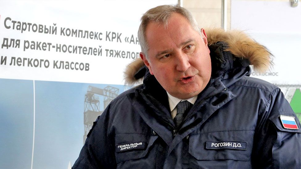 Roscosmos chief Dmitry Rogozin gives some explanations to Russian President and his Belarus counterpart during their visit at the Vostochny cosmodrome, some 180 km north of Blagoveschensk, Amur region on April 12, 2022.