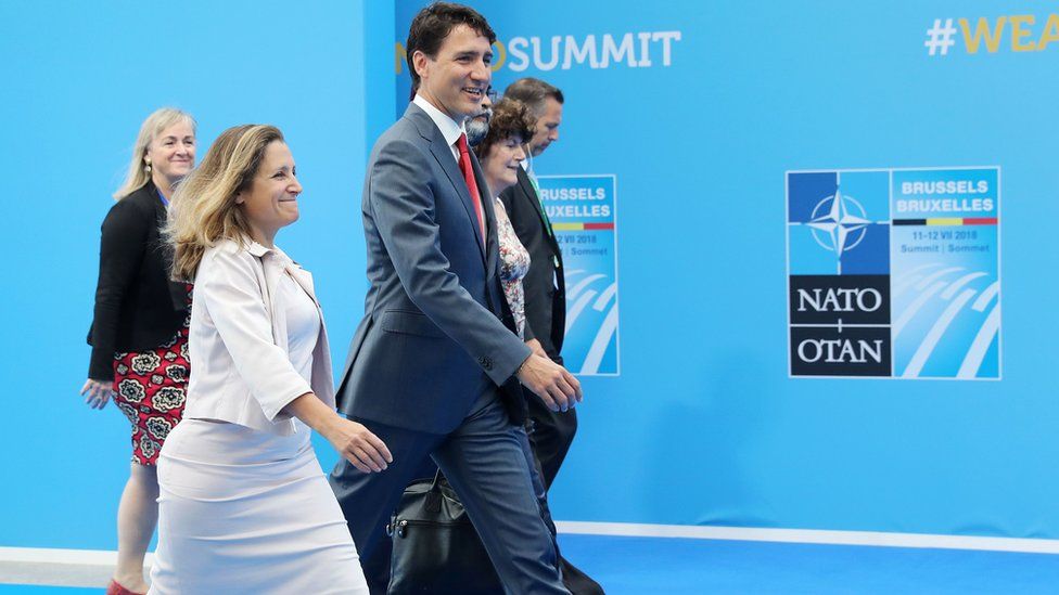 Canada's Foreign Minister Chrystia Freeland (C) and Canadian Prime Minister Justin Trudeau (3R) arrive to attend the second day of the Nato summit in Brussels on July 12, 2018